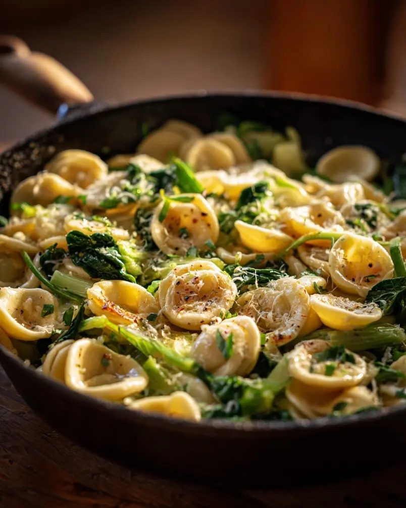 One Pan Orecchiette Pasta 2 A close-up shot of orecchiette pasta being prepared in a pan with fresh ingredients.